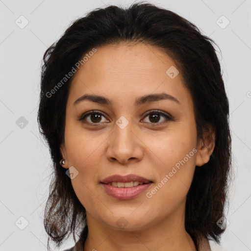 Joyful latino young-adult female with medium  brown hair and brown eyes