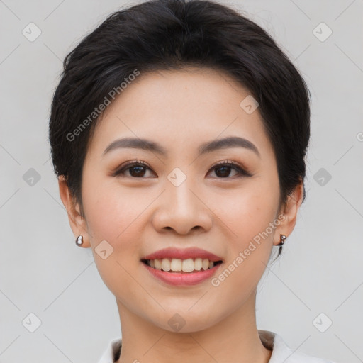 Joyful asian young-adult female with short  brown hair and brown eyes