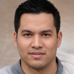 Joyful white young-adult male with short  black hair and brown eyes