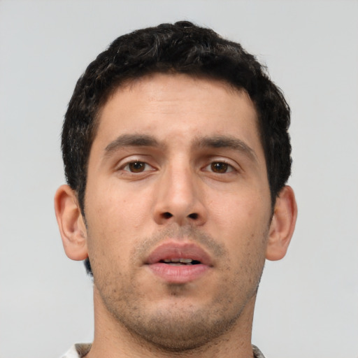 Neutral white young-adult male with short  black hair and brown eyes
