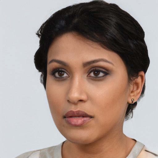 Neutral latino young-adult female with short  black hair and brown eyes