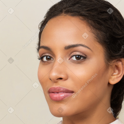 Joyful latino young-adult female with long  brown hair and brown eyes