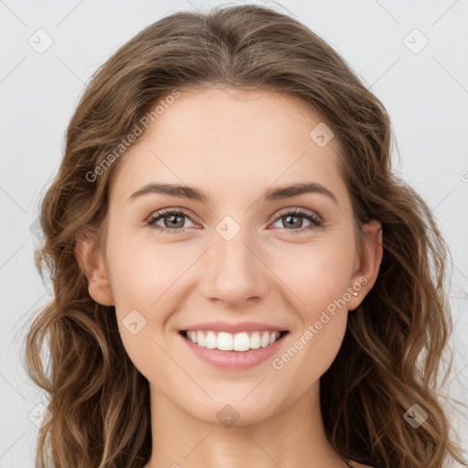 Joyful white young-adult female with long  brown hair and green eyes