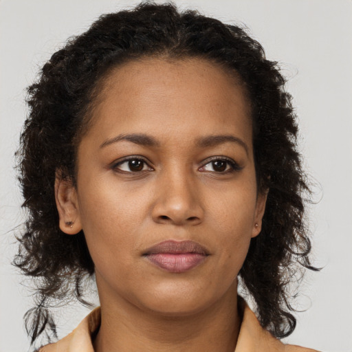 Neutral black young-adult female with long  brown hair and brown eyes
