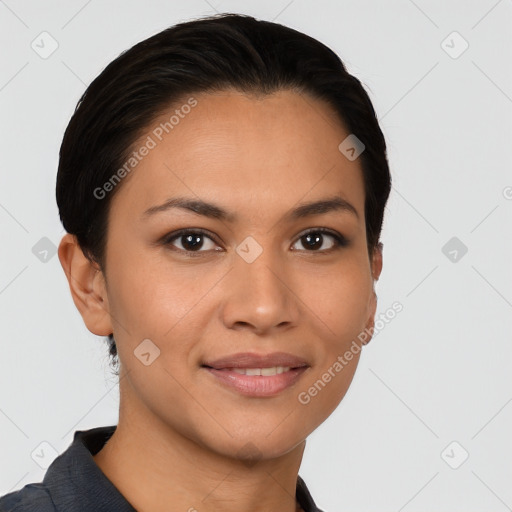 Joyful latino young-adult female with short  black hair and brown eyes