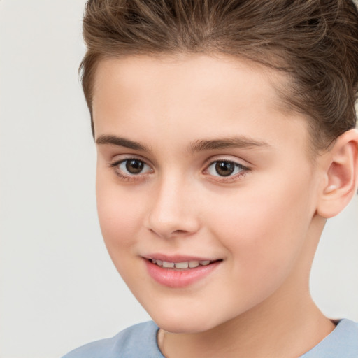 Joyful white child female with short  brown hair and brown eyes