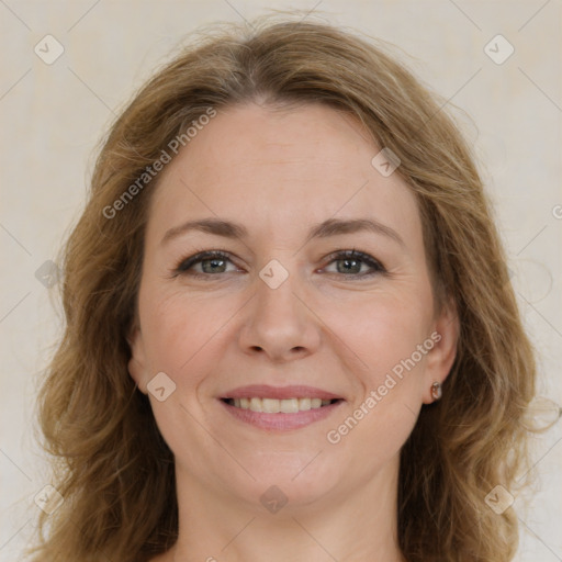 Joyful white adult female with long  brown hair and brown eyes