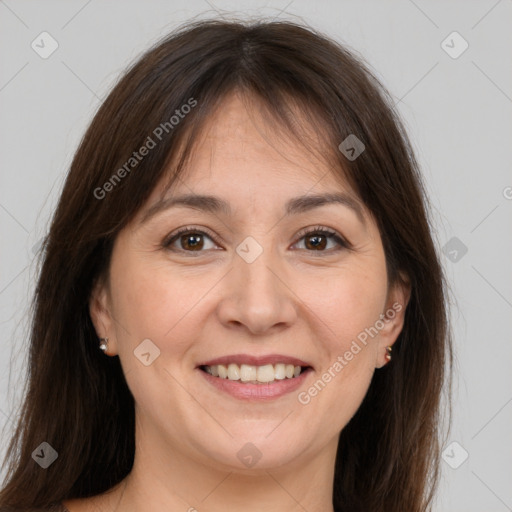 Joyful white adult female with medium  brown hair and brown eyes