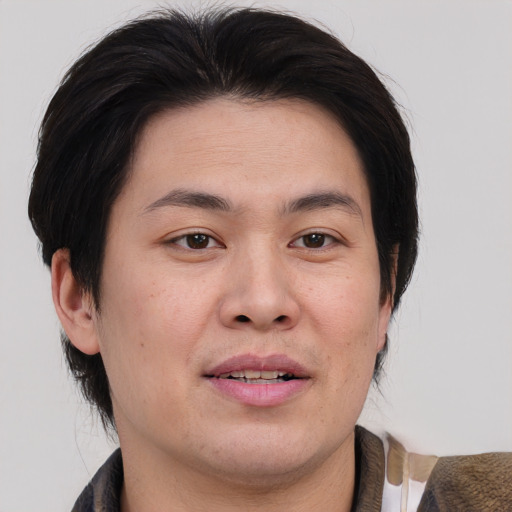 Joyful white adult male with medium  brown hair and brown eyes