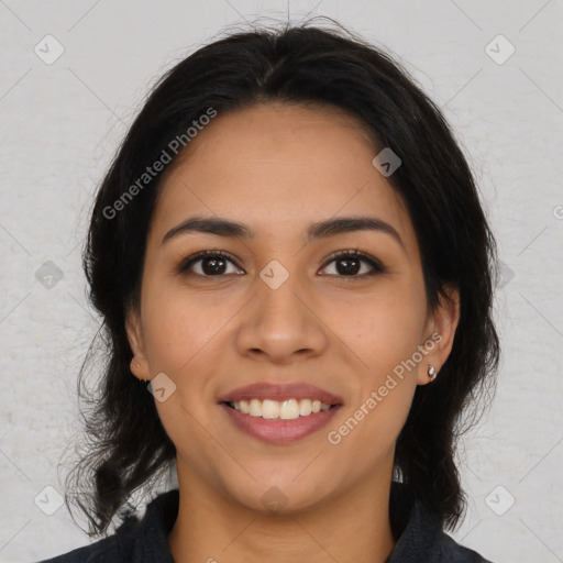 Joyful latino young-adult female with medium  brown hair and brown eyes