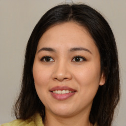 Joyful asian young-adult female with medium  brown hair and brown eyes