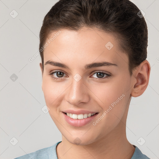 Joyful white young-adult female with short  brown hair and brown eyes