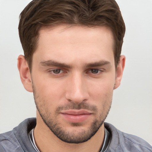 Neutral white young-adult male with short  brown hair and grey eyes