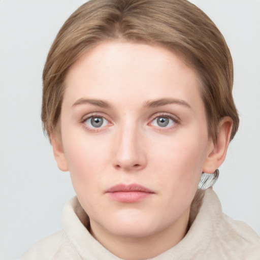 Neutral white young-adult female with short  brown hair and grey eyes