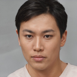 Neutral asian young-adult male with short  brown hair and brown eyes