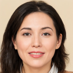 Joyful white young-adult female with medium  brown hair and brown eyes