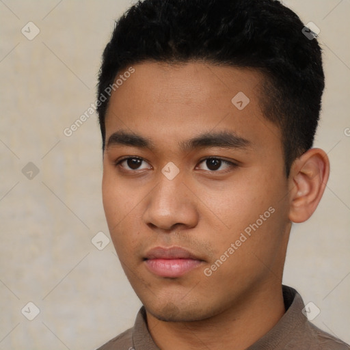 Neutral latino young-adult male with short  black hair and brown eyes