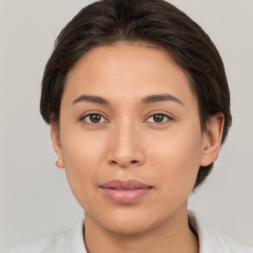 Joyful white young-adult female with medium  brown hair and brown eyes