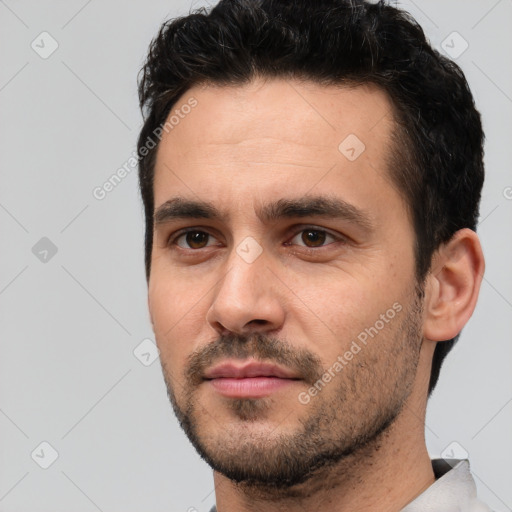Neutral white young-adult male with short  black hair and brown eyes