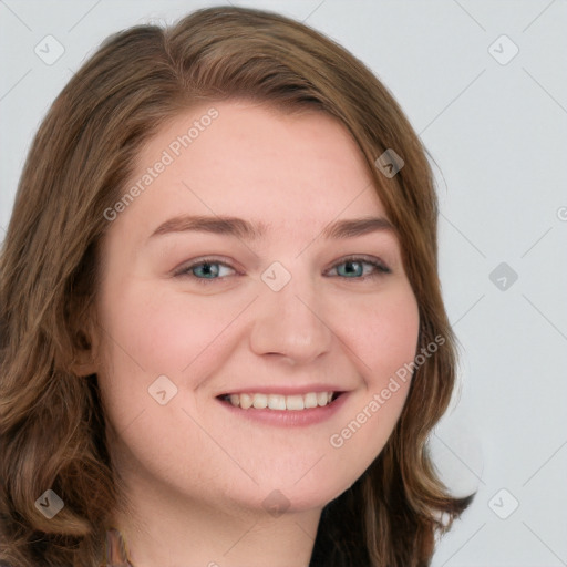 Joyful white young-adult female with long  brown hair and blue eyes