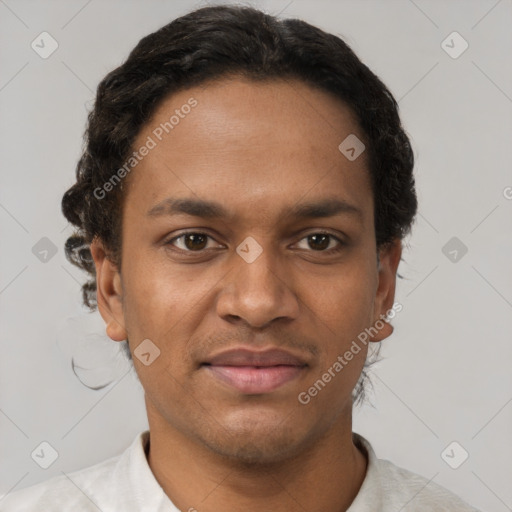 Joyful black young-adult male with short  brown hair and brown eyes