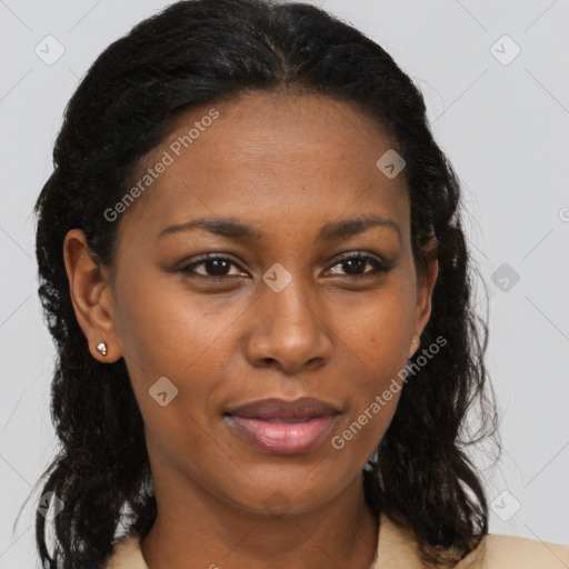 Joyful black young-adult female with long  brown hair and brown eyes