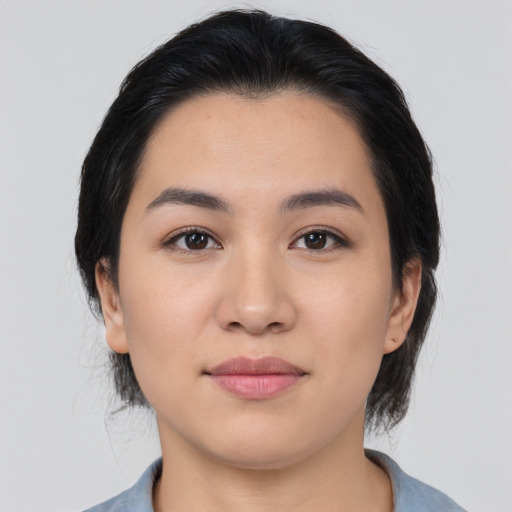 Joyful asian young-adult female with medium  black hair and brown eyes