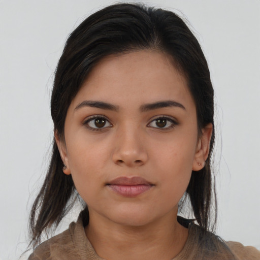 Neutral latino young-adult female with medium  brown hair and brown eyes