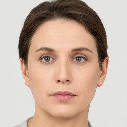 Neutral white young-adult female with short  brown hair and brown eyes