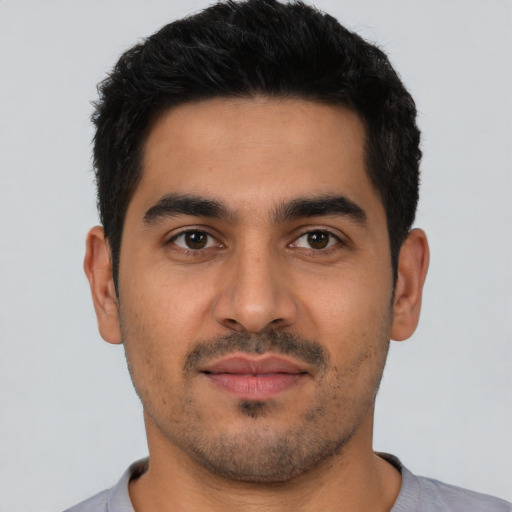 Neutral latino young-adult male with short  black hair and brown eyes