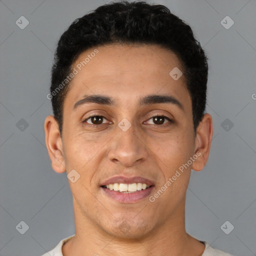 Joyful latino young-adult male with short  black hair and brown eyes