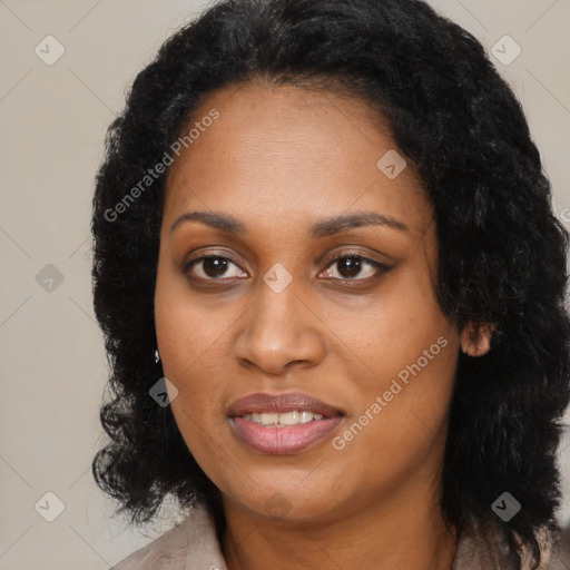 Joyful black adult female with long  black hair and brown eyes