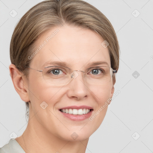 Joyful white adult female with short  brown hair and grey eyes