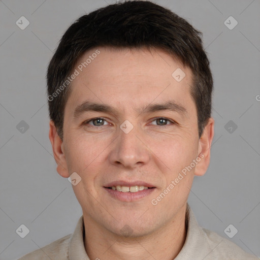 Joyful white adult male with short  brown hair and grey eyes