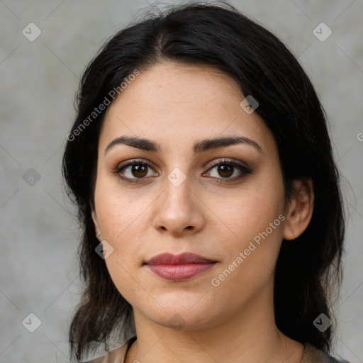 Joyful latino young-adult female with medium  brown hair and brown eyes