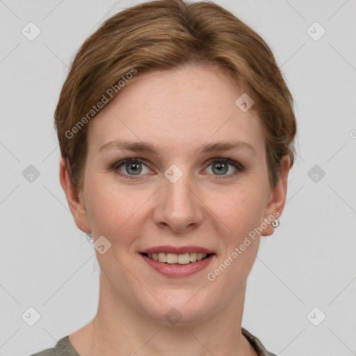 Joyful white young-adult female with short  brown hair and grey eyes