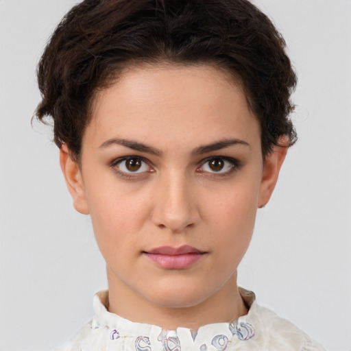 Neutral white young-adult female with short  brown hair and brown eyes