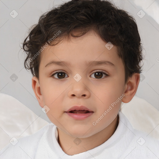 Joyful white child male with short  brown hair and brown eyes