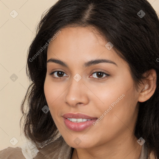 Joyful latino young-adult female with long  brown hair and brown eyes