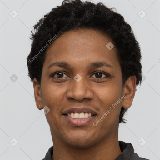 Joyful black young-adult female with short  black hair and brown eyes
