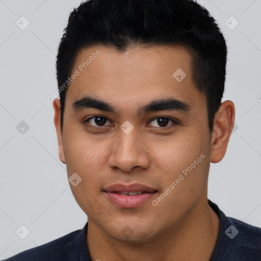 Joyful latino young-adult male with short  black hair and brown eyes