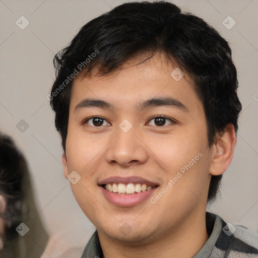 Joyful white young-adult male with short  black hair and brown eyes