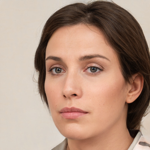 Neutral white young-adult female with medium  brown hair and grey eyes