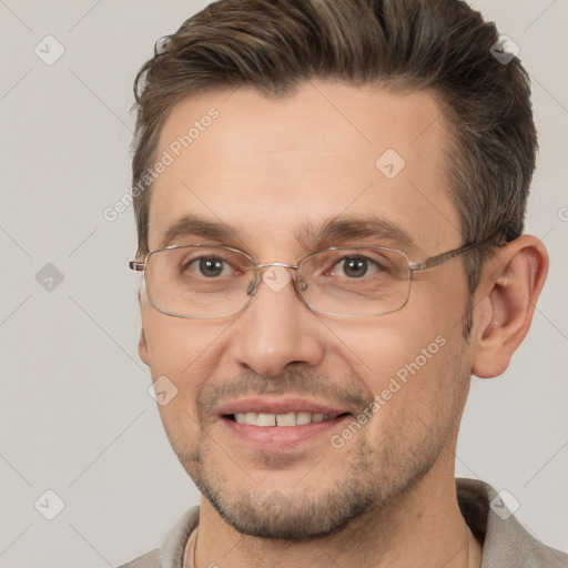 Joyful white adult male with short  brown hair and brown eyes