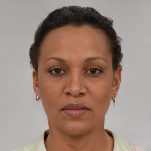 Neutral latino adult female with short  brown hair and brown eyes