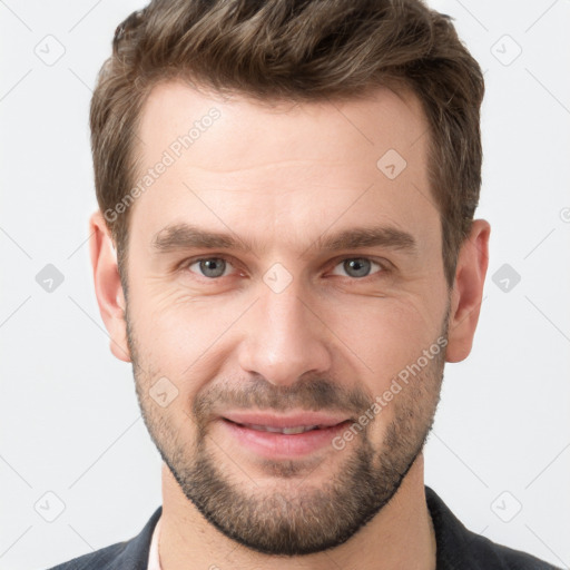 Joyful white young-adult male with short  brown hair and grey eyes