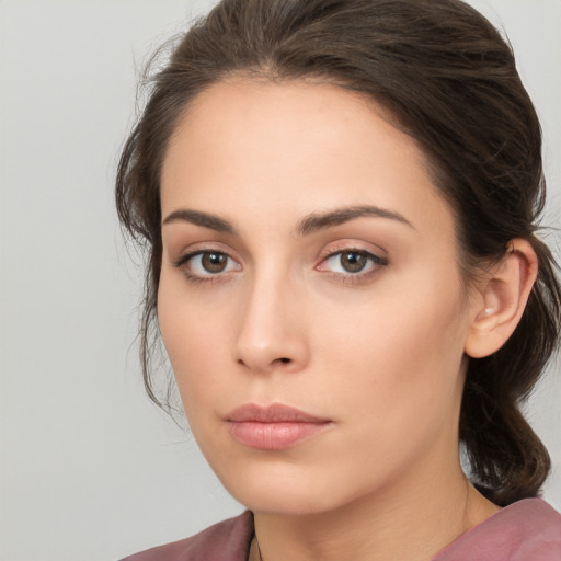 Neutral white young-adult female with medium  brown hair and brown eyes