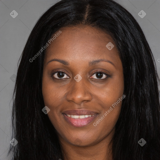 Joyful black young-adult female with long  black hair and brown eyes