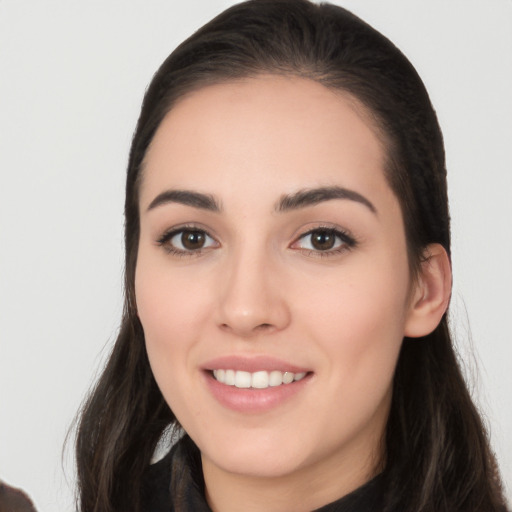 Joyful white young-adult female with long  black hair and brown eyes