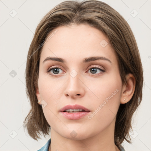 Neutral white young-adult female with medium  brown hair and grey eyes